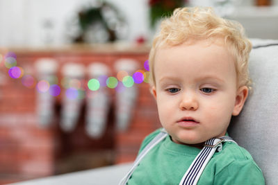 Close-up of cute boy looking away