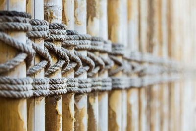 Close-up of rope tied on wood