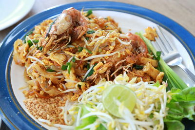 Close-up of pad thai kung  served on plate