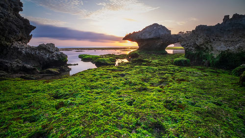 Dramatic sunset sky at ngrumput beach, yogyakarta, indonesia. hdr processed