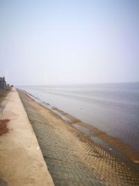 Scenic view of beach against clear sky