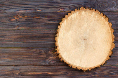 Sawed wood on a wooden background. top view, free space, space for text