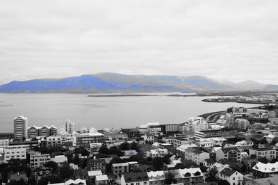 Cityscape with mountain range in background