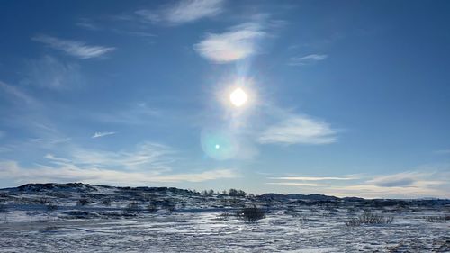 Scenic view of sea against sky during winter