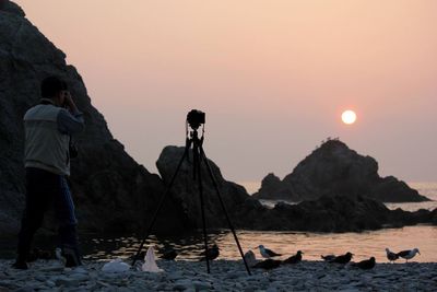 Scenic view of sea against clear sky during sunset