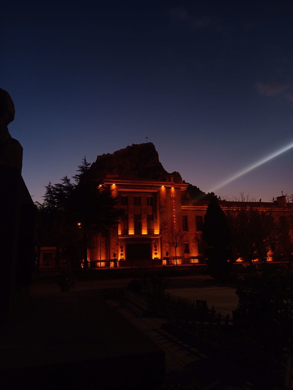 SILHOUETTE OF TEMPLE AT NIGHT