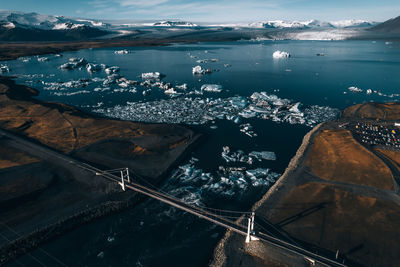 High angle view of city by sea