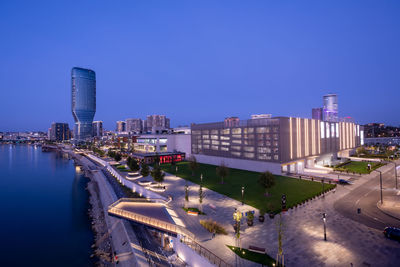 High angle view of cityscape against clear blue sky