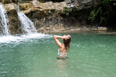 Full length of woman in water