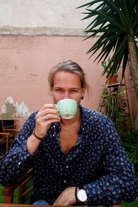 Portrait of man drinking coffee