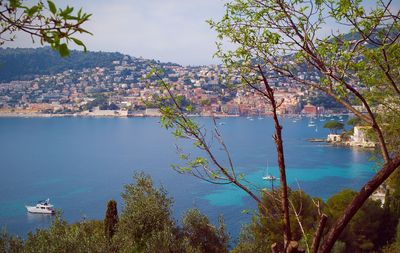 Scenic view of sea and mountains against sky