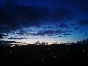 Silhouette of landscape against sky at dusk