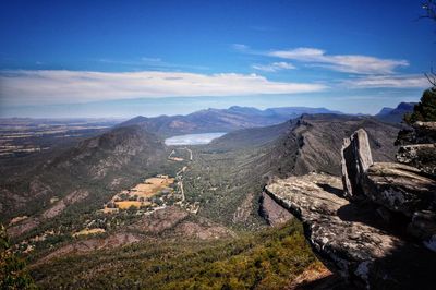 Scenic view of mountains against cloudy sky