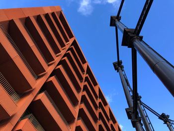 Low angle view of buildings against blue sky