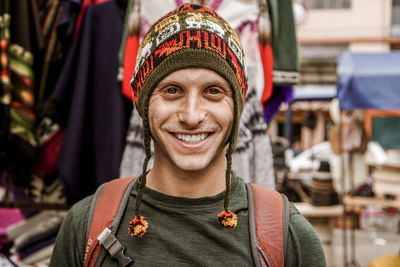 Portrait of smiling young man standing outdoors