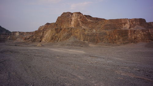 Rock formations in desert against sky