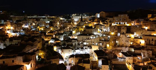 High angle view of illuminated buildings in city at night