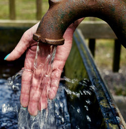 Close-up of hand holding water