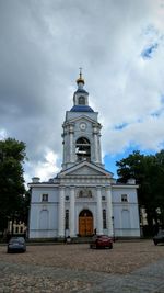 Low angle view of building against cloudy sky