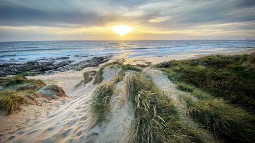 Scenic view of sea against sky during sunset