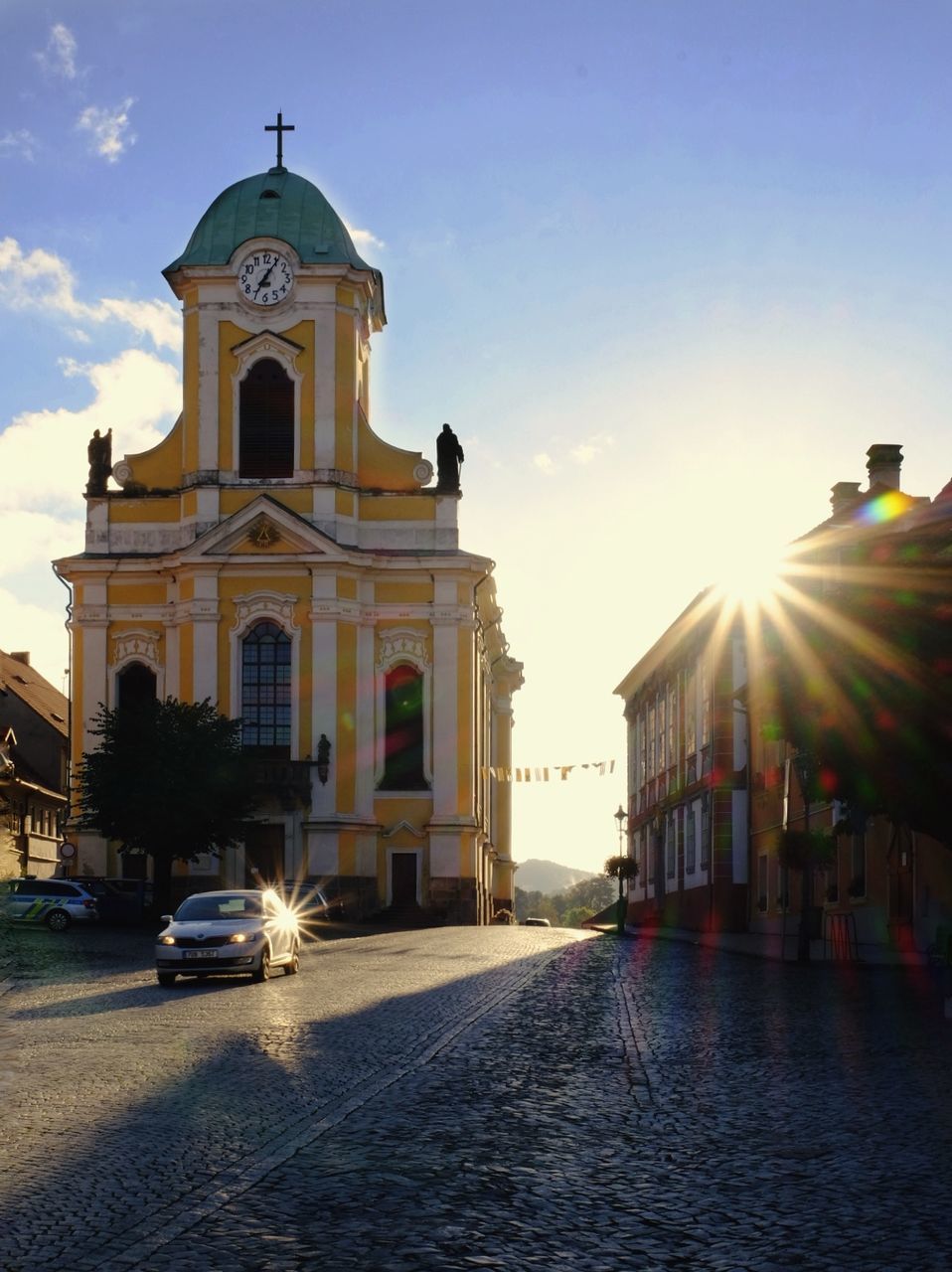 religion, spirituality, architecture, place of worship, built structure, building exterior, lens flare, sunlight, sunset, outdoors, sky, dome, no people, day