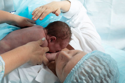 Midsection of doctor examining patient at spa