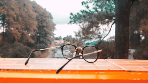 Close-up of eyeglasses on table by window