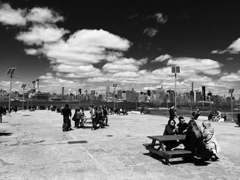 People relaxing on city street