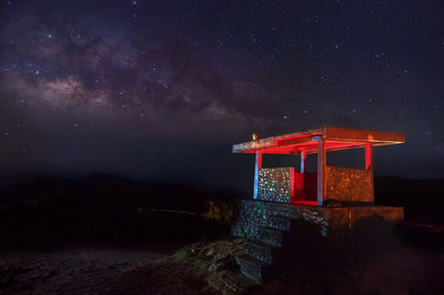 Illuminated structure against sky at night