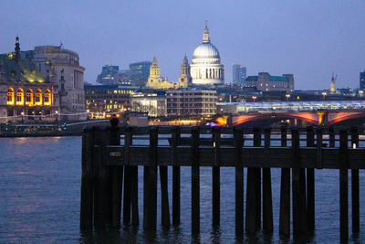 Illuminated city at waterfront