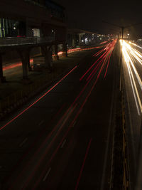 Light trails on road in city at night