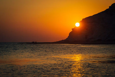 Scenic view of sea at sunset