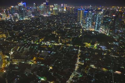 Aerial view of illuminated city at night