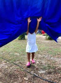 Rear view of women on field