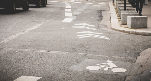 High angle view of arrow symbol on road