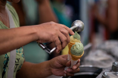 Midsection of person holding ice cream