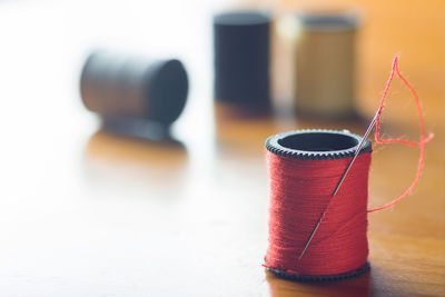 Close-up of thread spool on table