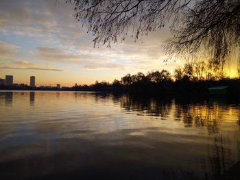 Scenic view of lake against sky during sunset