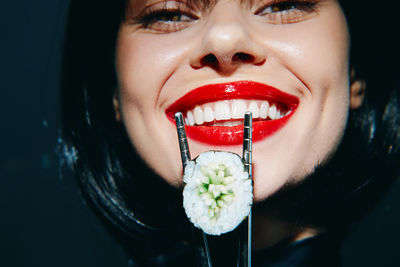 Close-up portrait of young woman with eyes closed