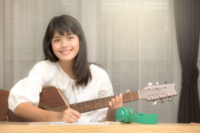 Portrait of smiling girl playing