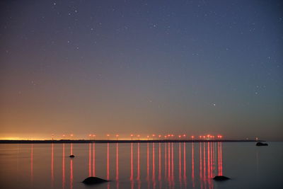 Scenic view of sea against sky at night