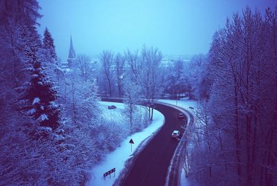 Snow covered landscape against clear sky