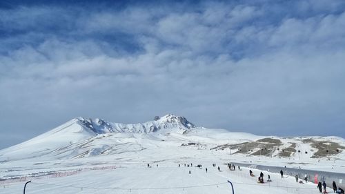 Scenic view of snowcapped mountains against sky