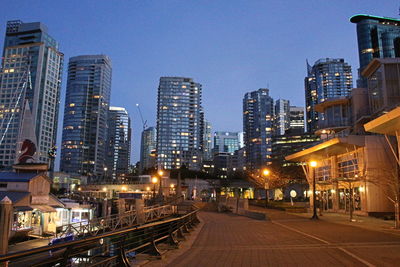 Illuminated buildings against clear sky