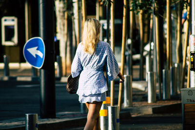 Rear view of woman walking in city