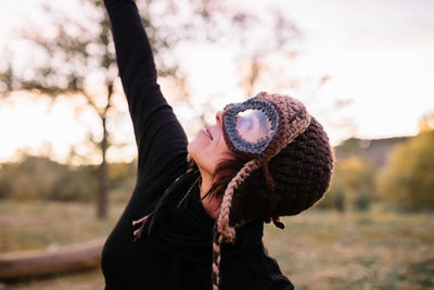 Portrait of person wearing hat during winter