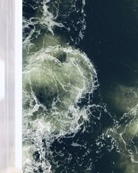 High angle view of water splashing in sea