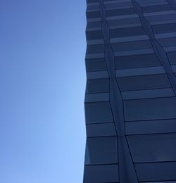 Low angle view of building against clear blue sky