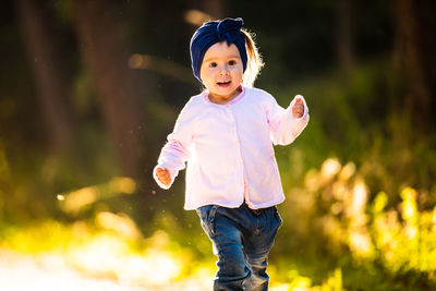 Cute girl running at park