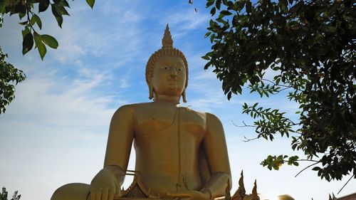 Low angle view of statue against sky